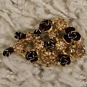 Elegant Gold Floral Brooch with Champagne Rhinestones